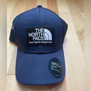 The North Face adjustable snap back hat in navy blue, brand new without tags